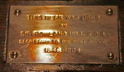Image of a plaque on desk used by Rowland Hill